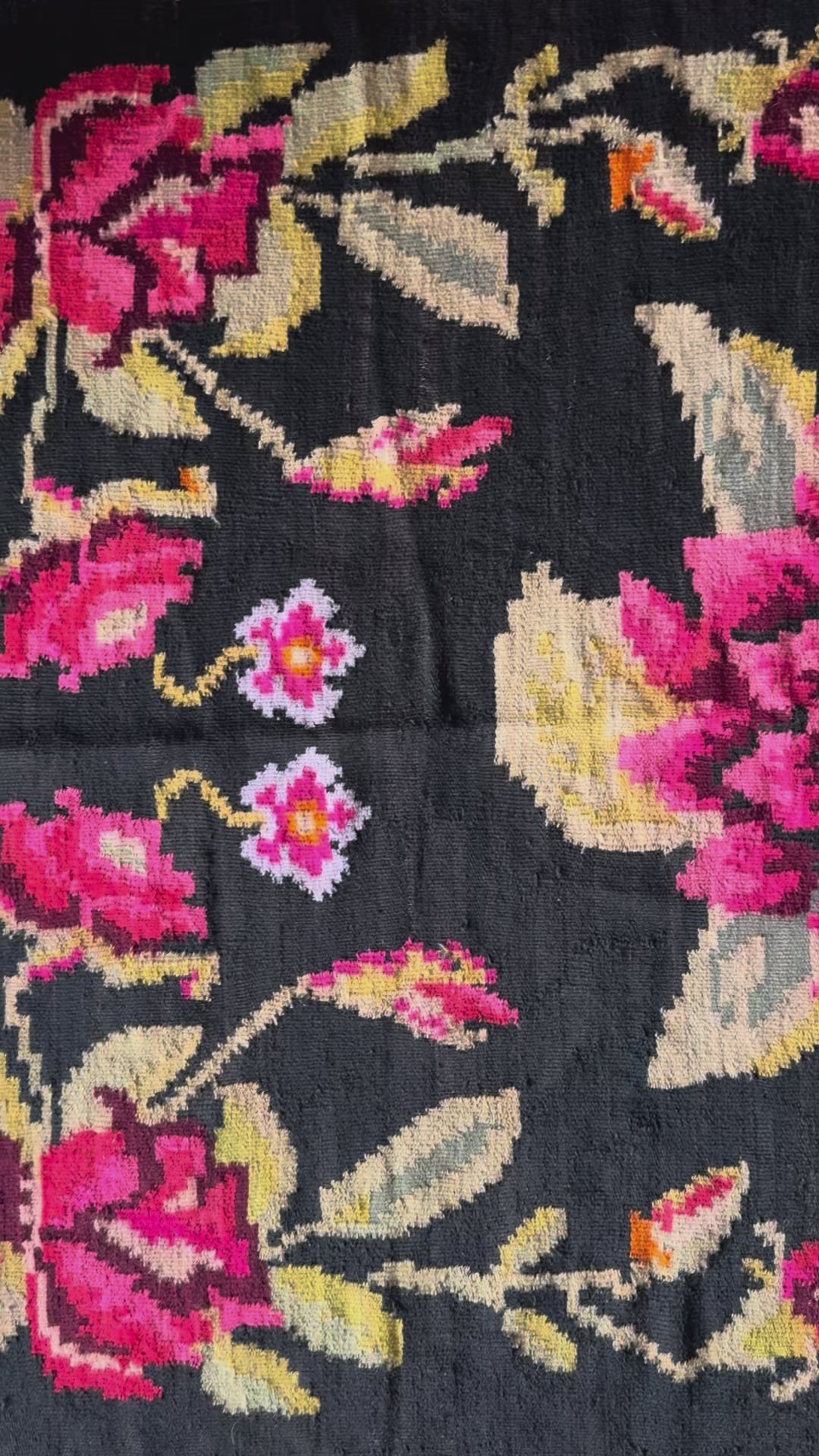 Traditional Romanian floral rug with black background and vibrant colours