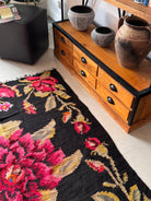 Vintage Romanian folk rug with intricate floral patterns and rich colours