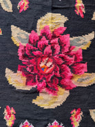 Authentic Romanian folk textile featuring vibrant traditional floral motifs